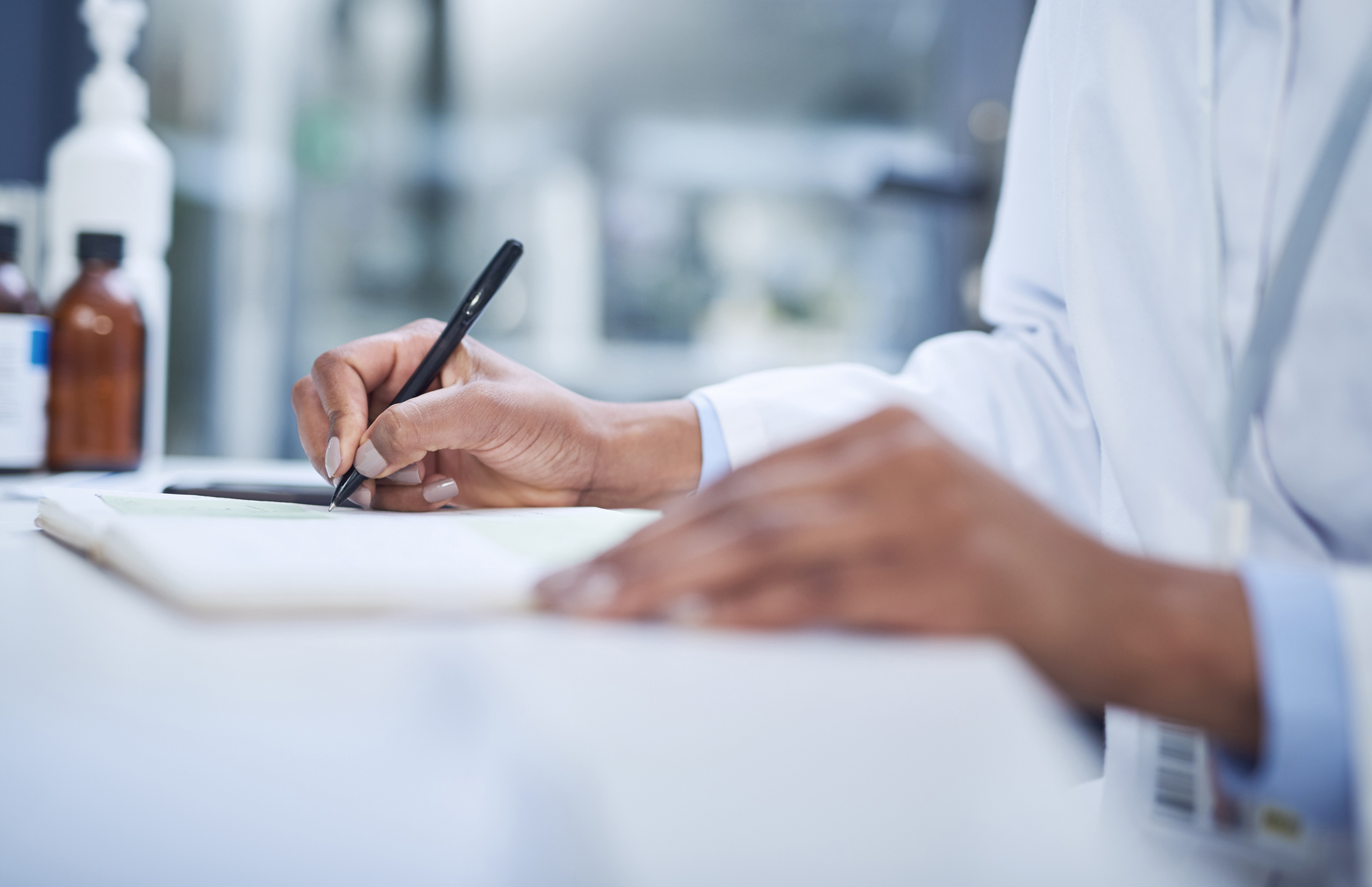 a close-up of a hand holding a pen